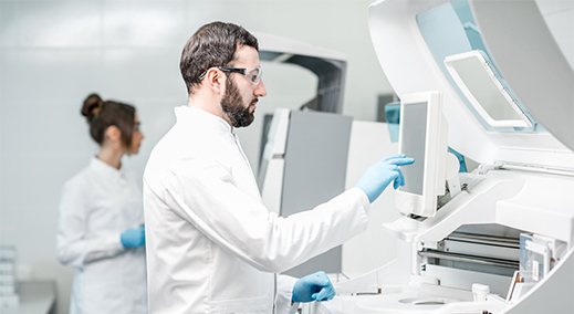 health lab employee in front of DATA MODUL panel pc