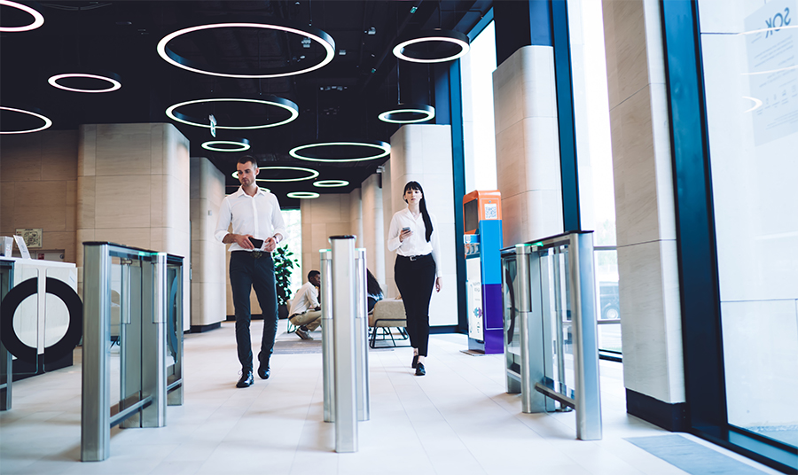 Additional features coworkers passing checkpoint at workplace